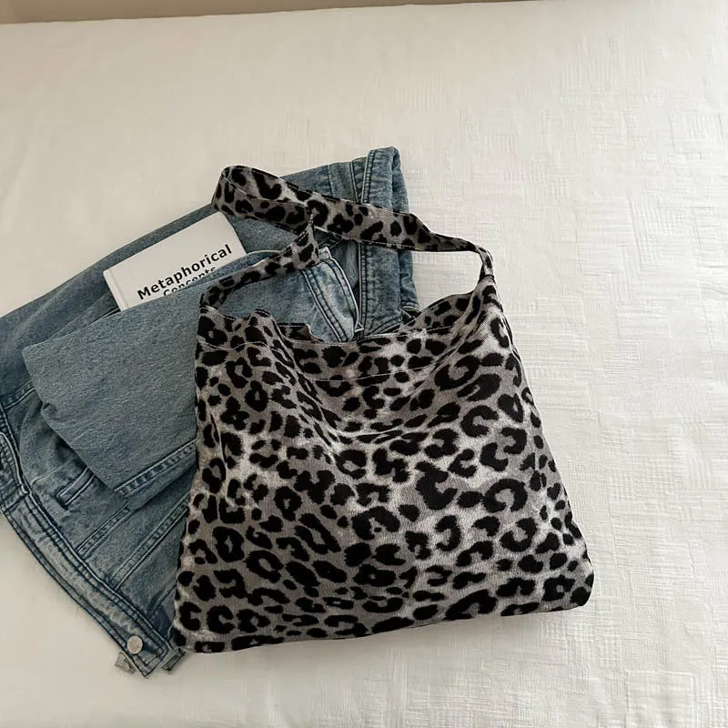 Leopard print shoulder messenger bag with square vertical shape and single strap, available in black, brown, and pink
