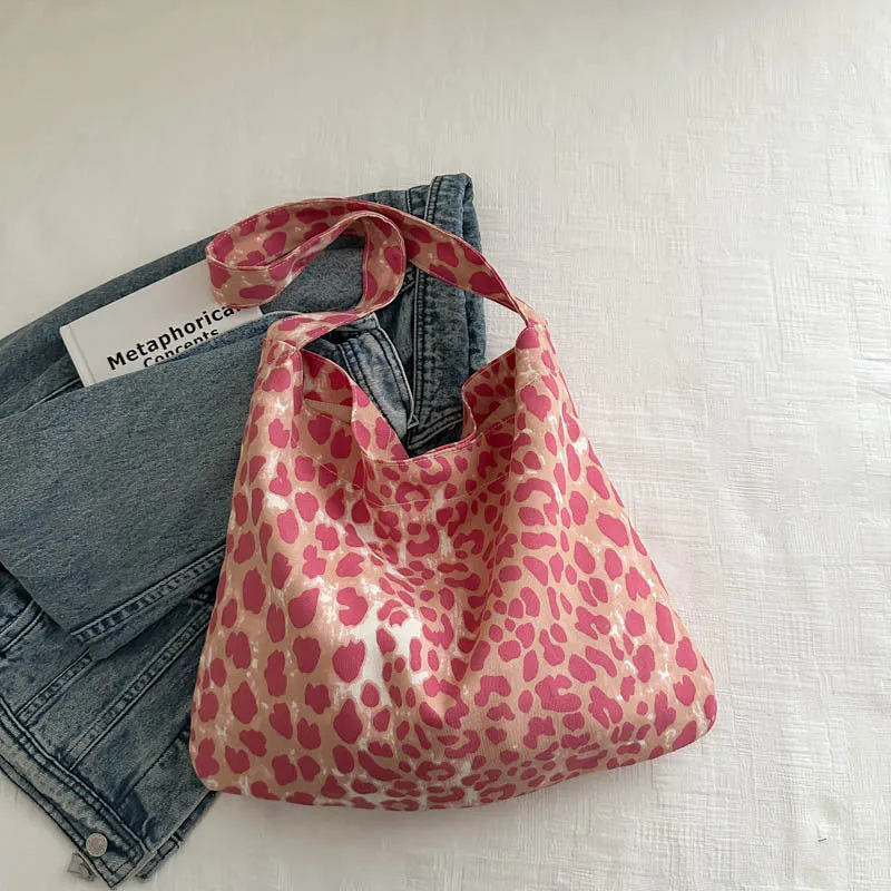 Leopard print shoulder messenger bag with square vertical shape and single strap, available in black, brown, and pink