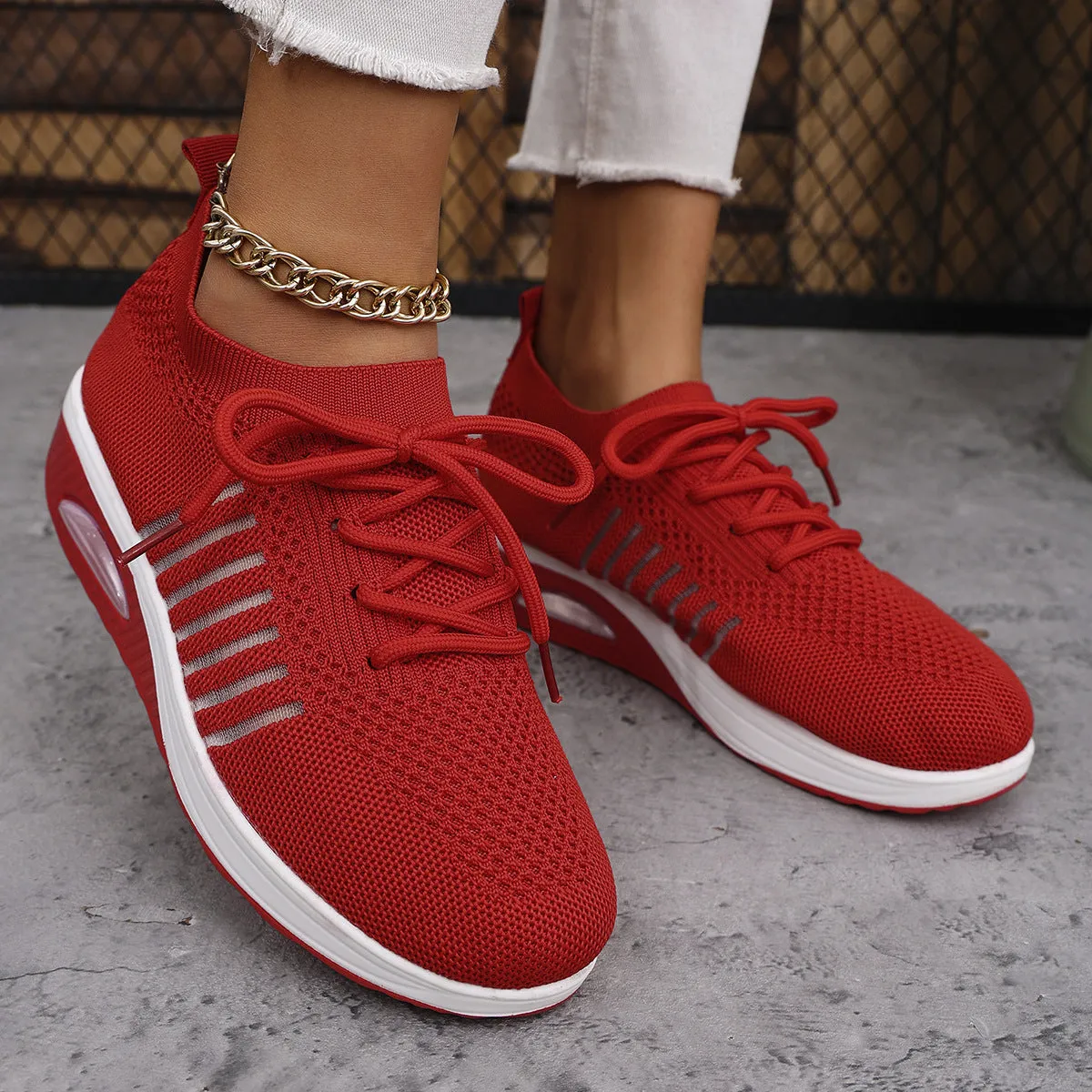 Women's lace-up slip-on wedge sports shoes in black with mesh upper and mid heel height increase