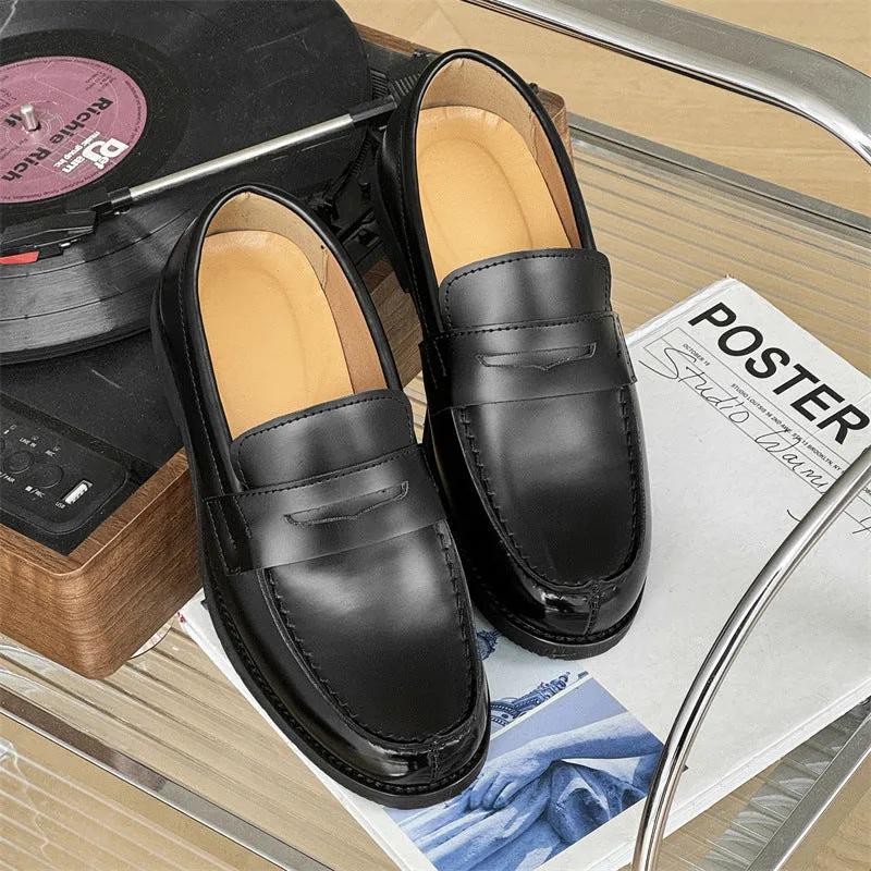 Black men's classic slip-on derby leather shoes with a rubber sole on a white background