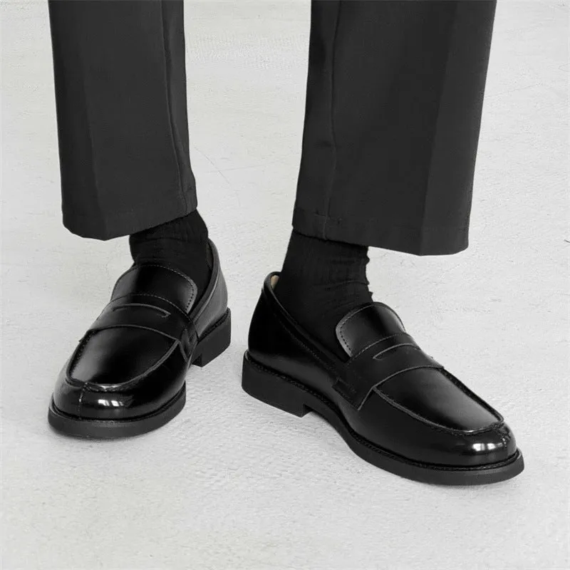 Black men's classic slip-on derby leather shoes with a rubber sole on a white background