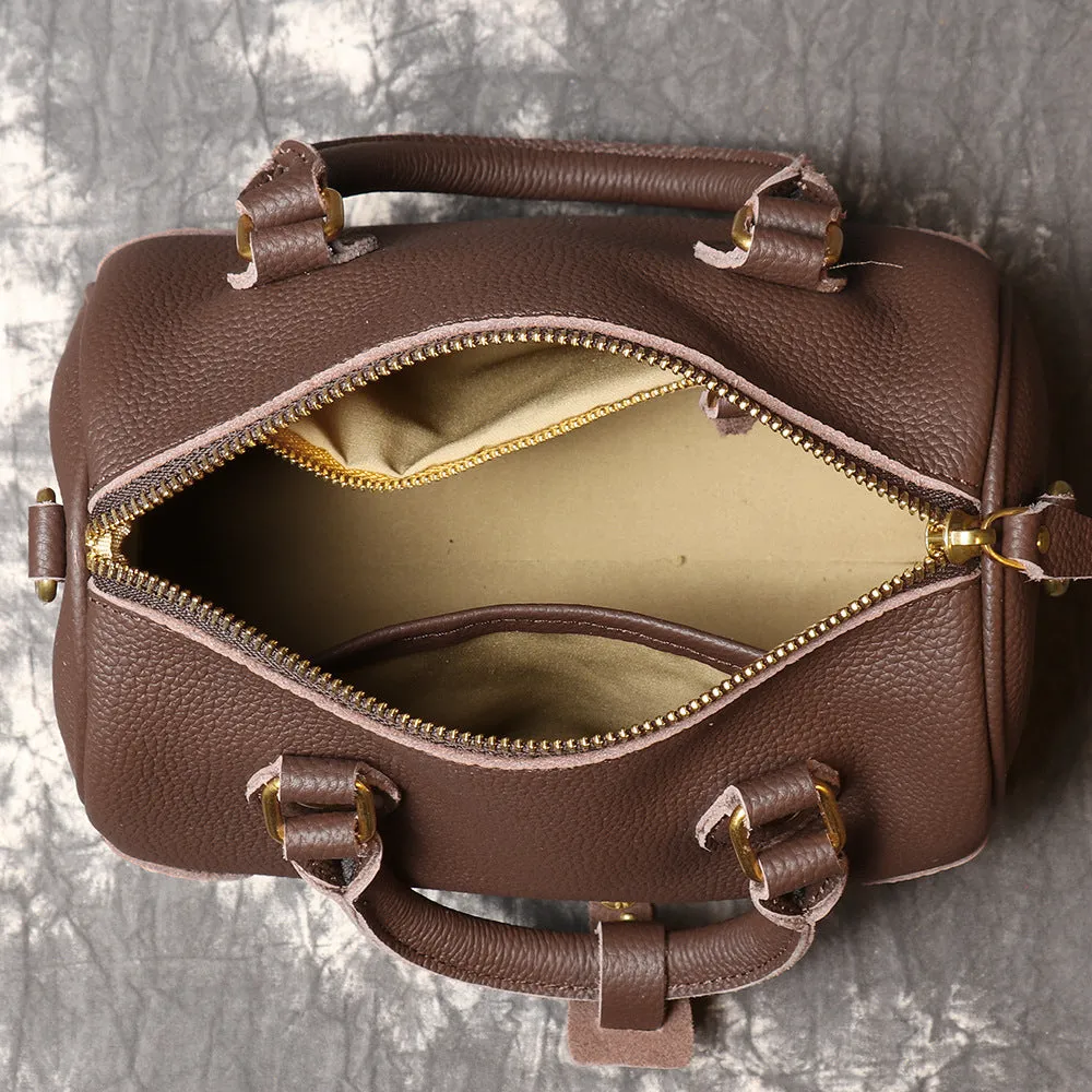 Brown yellow first layer cowhide Boston bag with cylindrical shape and single shoulder strap