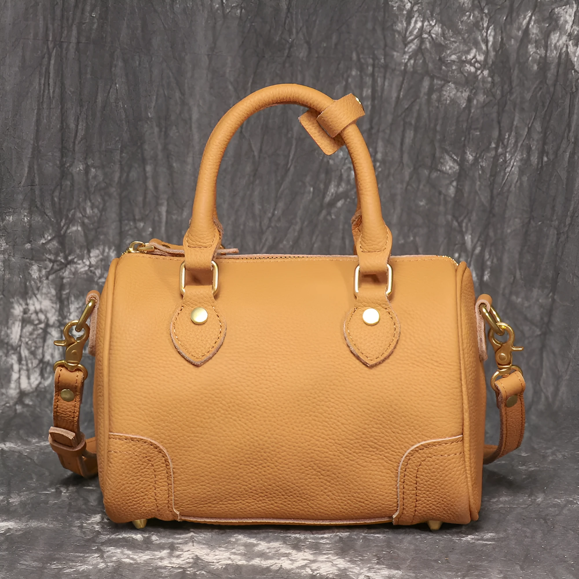 Brown yellow first layer cowhide Boston bag with cylindrical shape and single shoulder strap