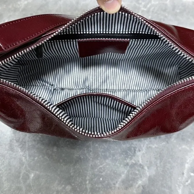 Women's oil wax leather crossbody bucket bag in anch red with zippered inner pocket, 29x18x8cm