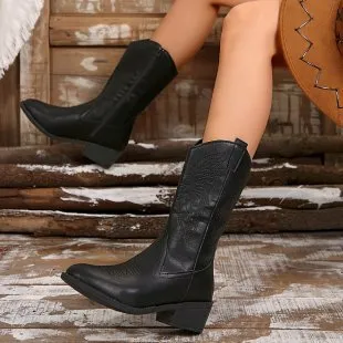 Women's black mid-calf Martin boots with chunky heel, pointed toe, and hollow out detailing