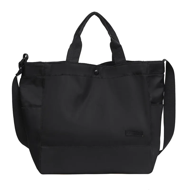 Large capacity nylon crossbody bag for women, black colour, soft material, with three shoulder straps