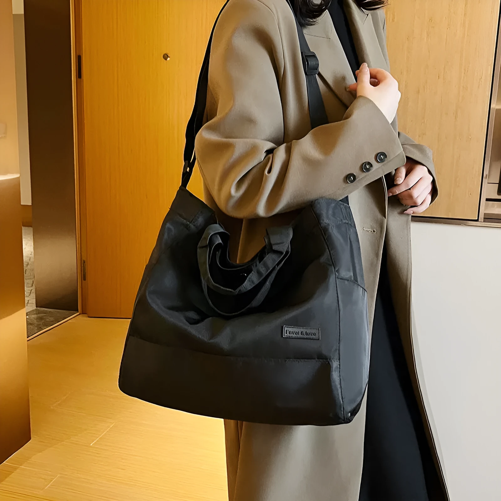 Large capacity nylon crossbody bag for women, black colour, soft material, with three shoulder straps