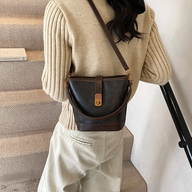 Women's PU handbag in simple style available in black, brown, and coffee colours in large and small sizes