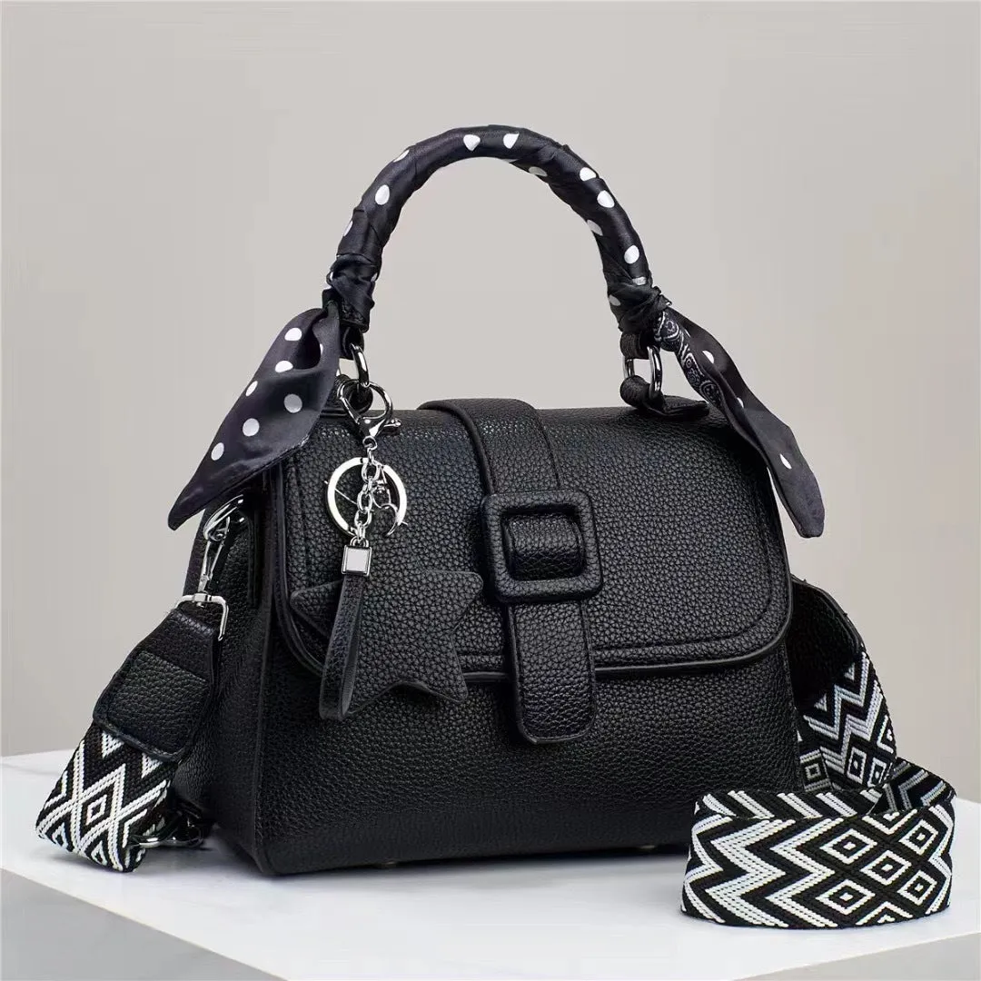 Solid colour handbag in beige with crocodile pattern texture, featuring a zippered top and interior organisation pockets