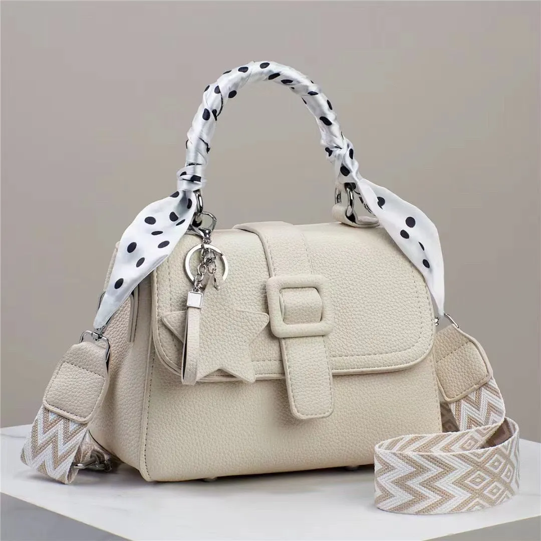 Solid colour handbag in beige with crocodile pattern texture, featuring a zippered top and interior organisation pockets