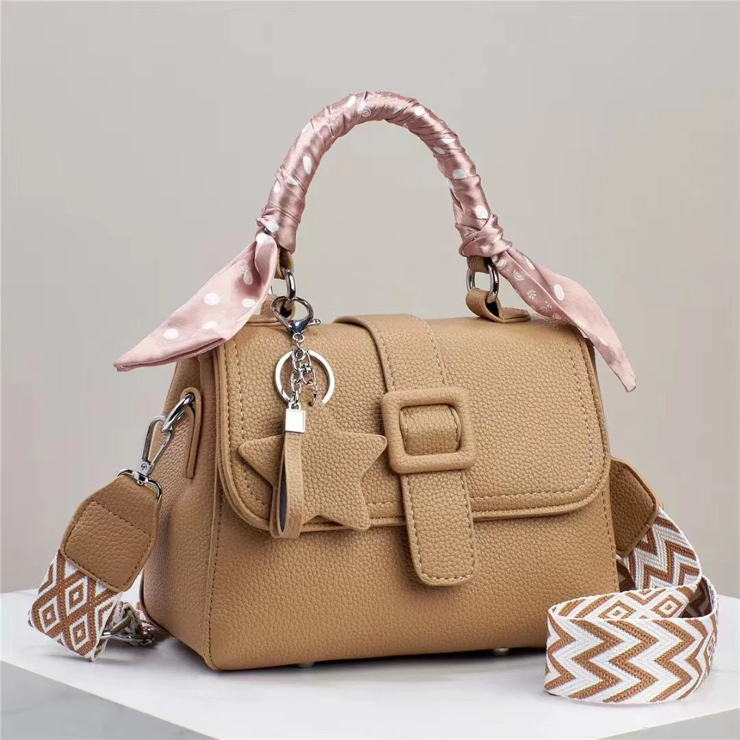 Solid colour handbag in beige with crocodile pattern texture, featuring a zippered top and interior organisation pockets