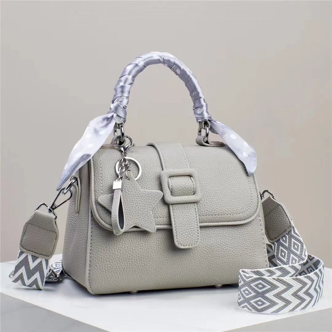 Solid colour handbag in beige with crocodile pattern texture, featuring a zippered top and interior organisation pockets