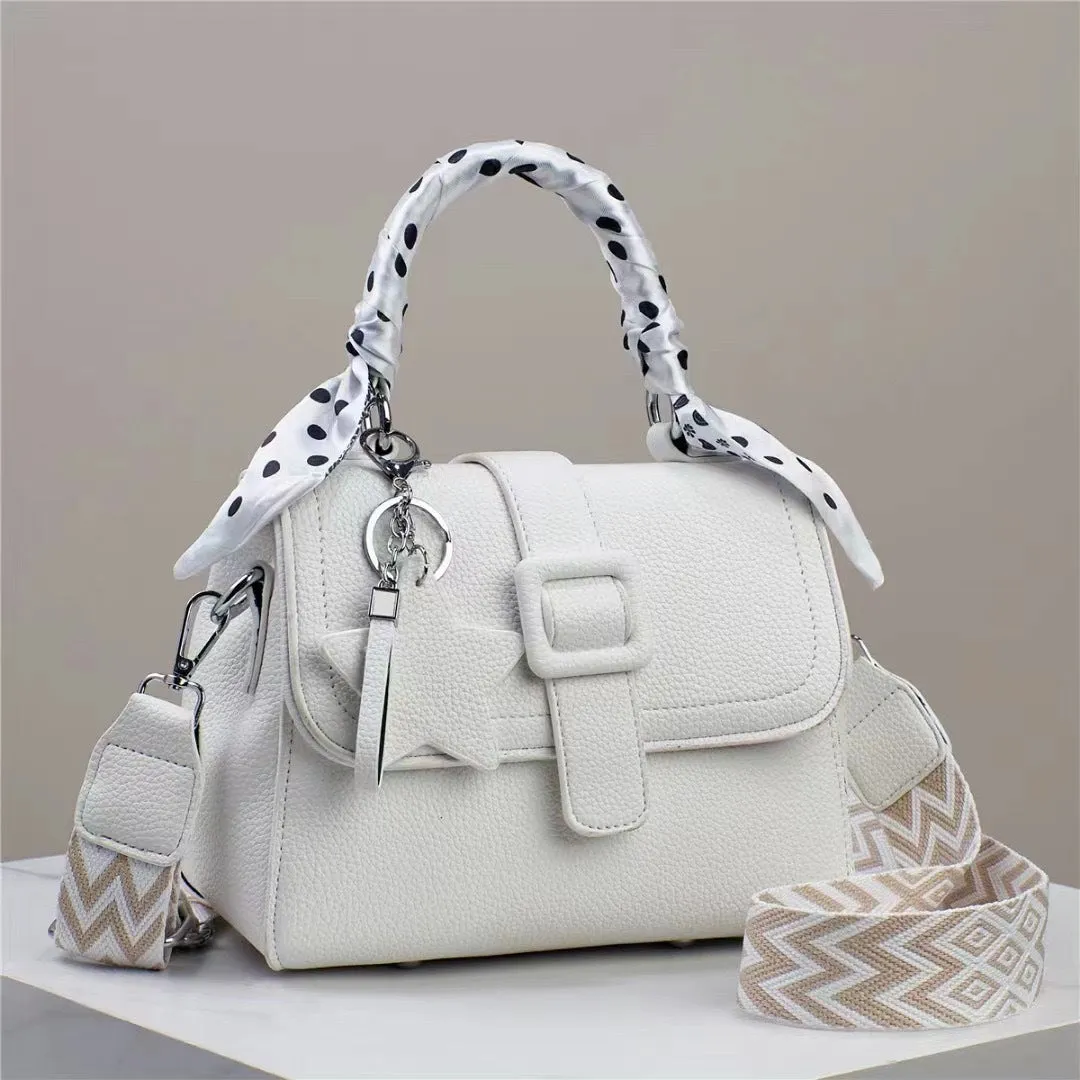 Solid colour handbag in beige with crocodile pattern texture, featuring a zippered top and interior organisation pockets