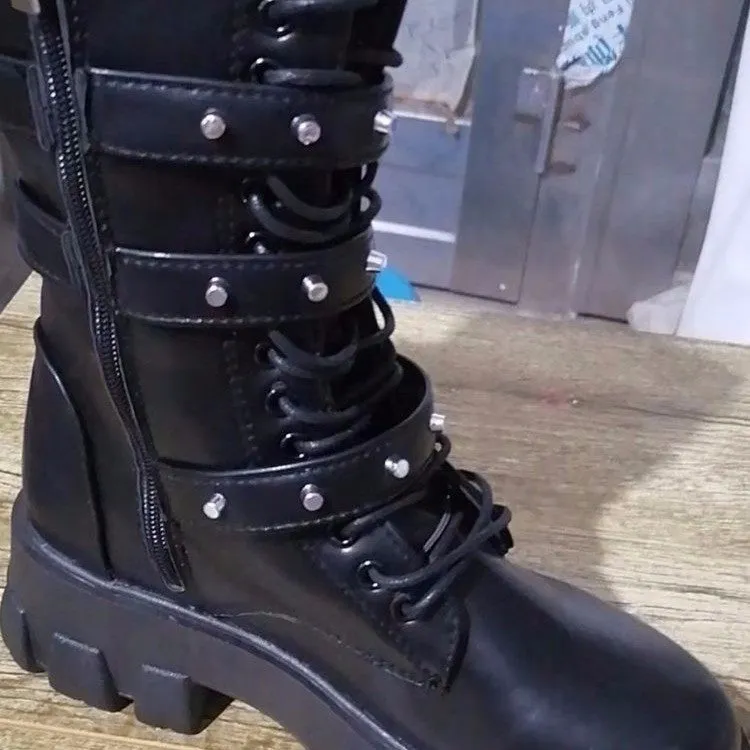 Women's black mid-calf knight boots with a metal buckle and side zip fastening