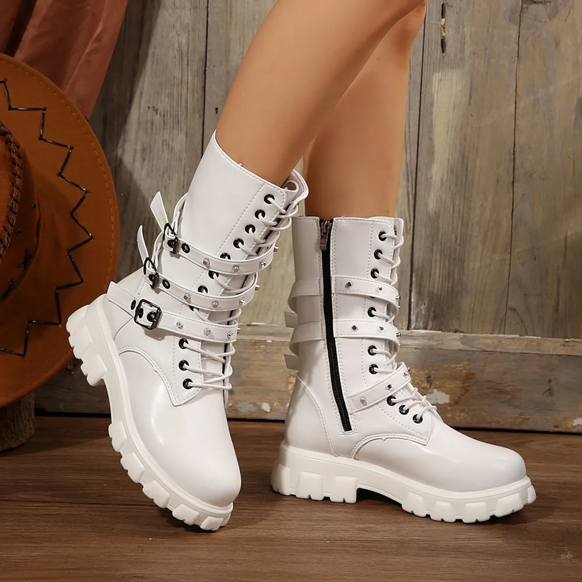 Women's black mid-calf knight boots with a metal buckle and side zip fastening