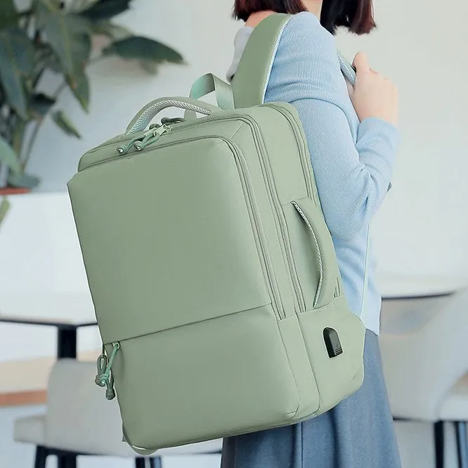 Green waterproof Oxford cloth backpack for business travel with air pillow straps, 45cm tall.