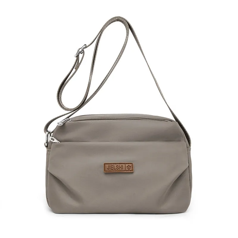 Women's soft nylon multi compartment shoulder bag in urban simplicity style, horizontal square shape, available in multiple colours