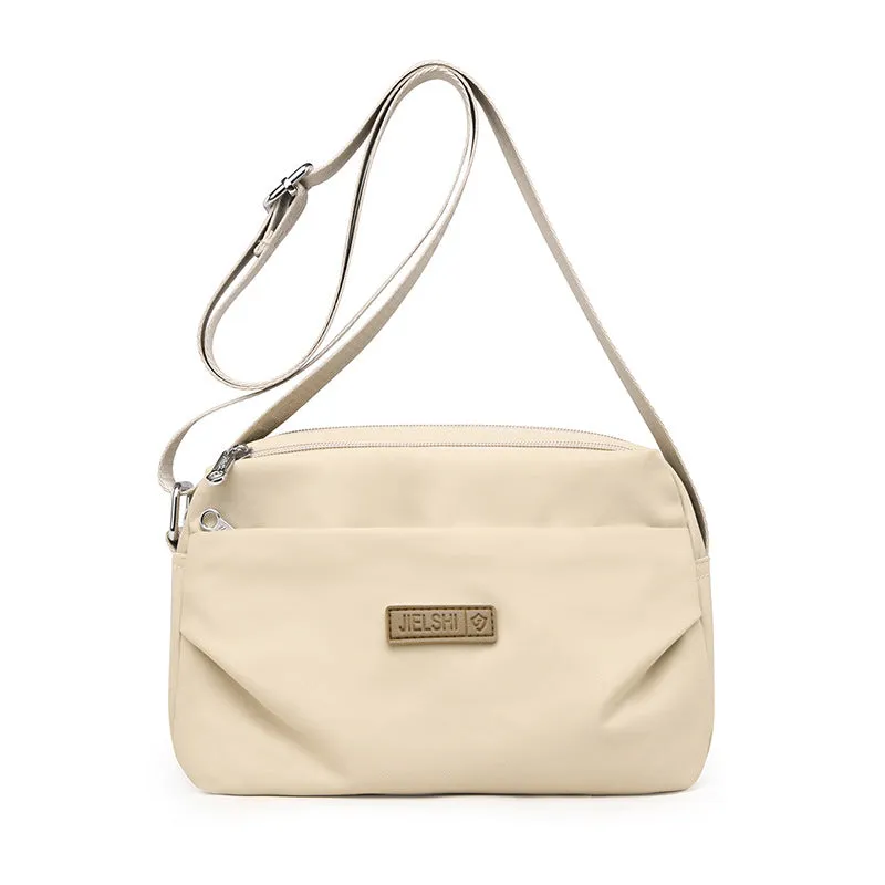 Women's soft nylon multi compartment shoulder bag in urban simplicity style, horizontal square shape, available in multiple colours