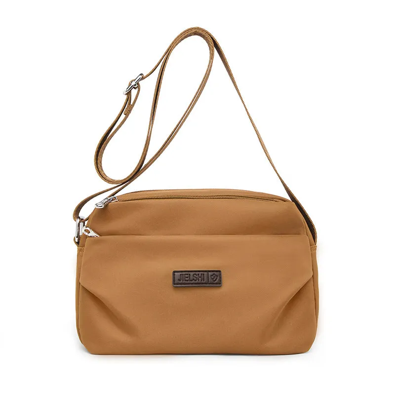 Women's soft nylon multi compartment shoulder bag in urban simplicity style, horizontal square shape, available in multiple colours