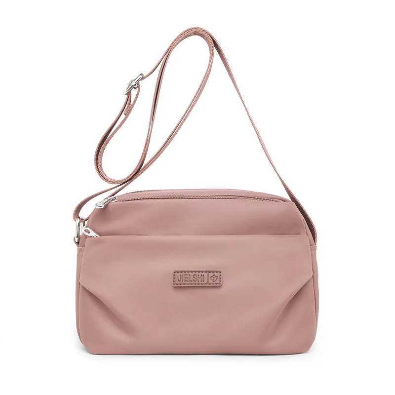 Women's soft nylon multi compartment shoulder bag in urban simplicity style, horizontal square shape, available in multiple colours