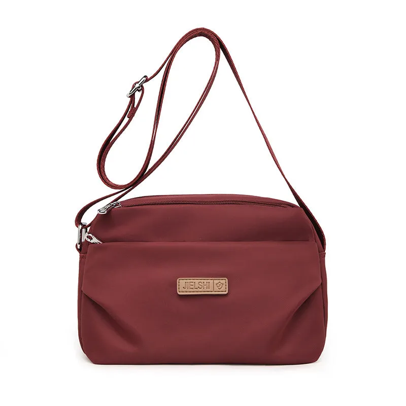 Women's soft nylon multi compartment shoulder bag in urban simplicity style, horizontal square shape, available in multiple colours