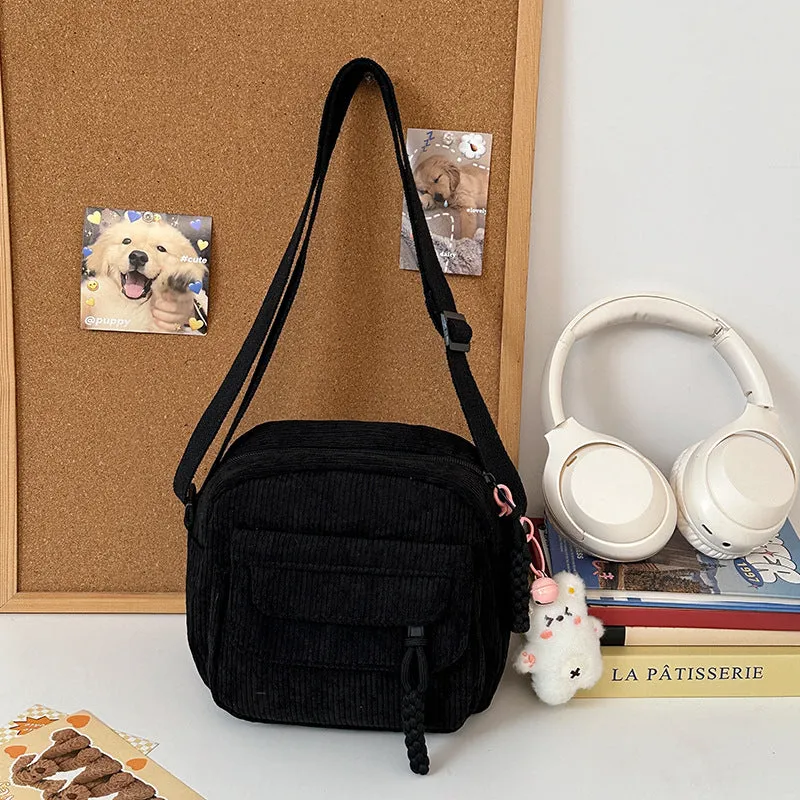 Corduroy crossbody shoulder bag in black with ribbon pendant, horizontal square shape