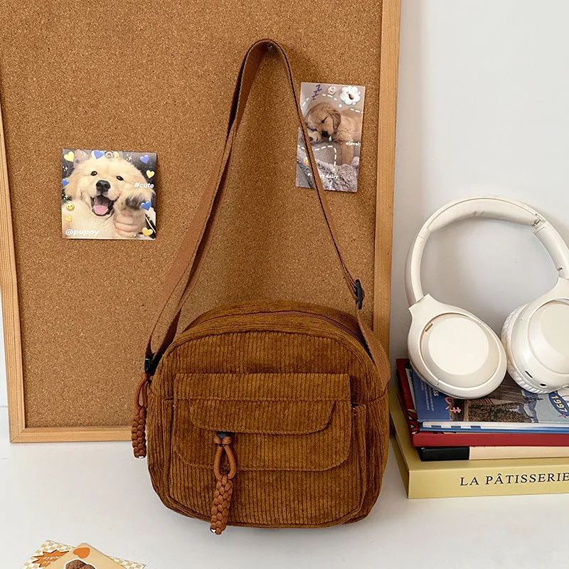 Corduroy crossbody shoulder bag in black with ribbon pendant, horizontal square shape