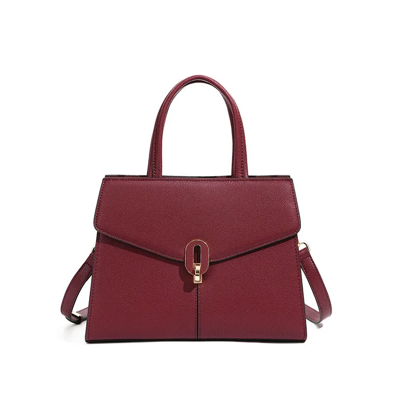 Genuine leather box handbag with litchi pattern and lock detail in brown