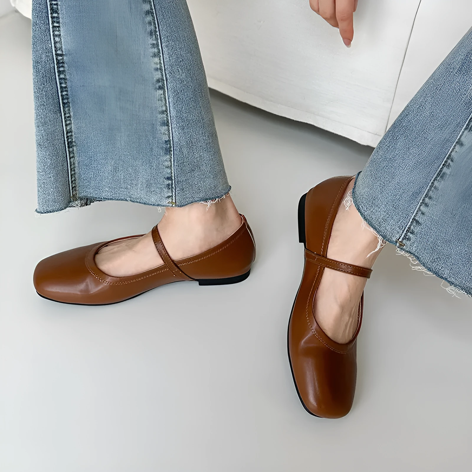 Retro style Mary Jane flat shoes in sheepskin with pigskin lining, shown in a solid colour with round toe and low heel.