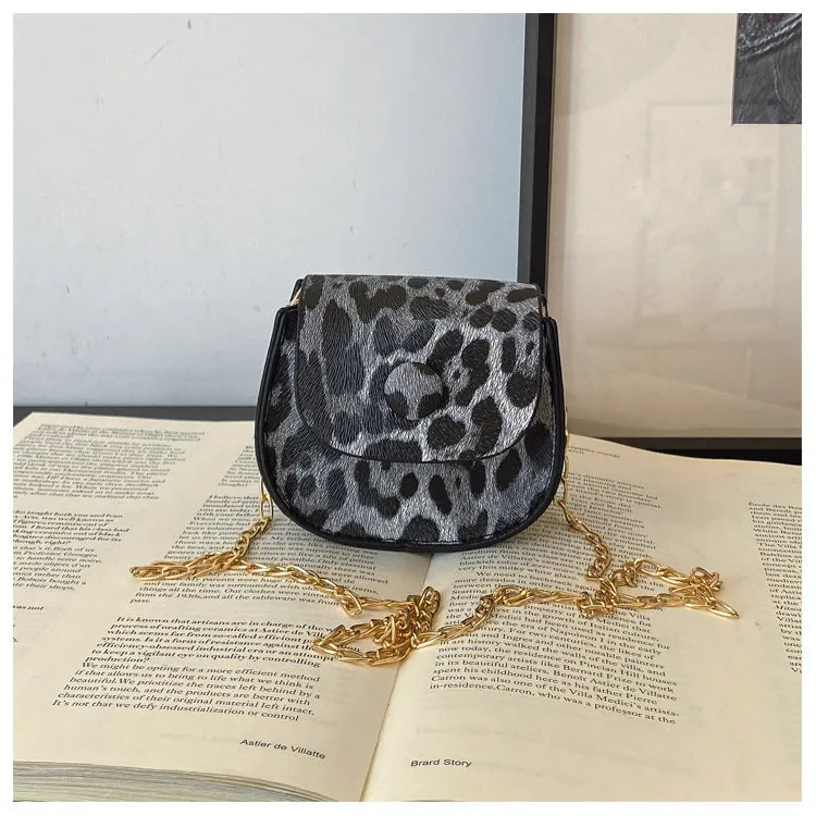 Leopard print mini crossbody saddle bag in PU, horizontal square shape with sandwich pocket, black and reddish brown