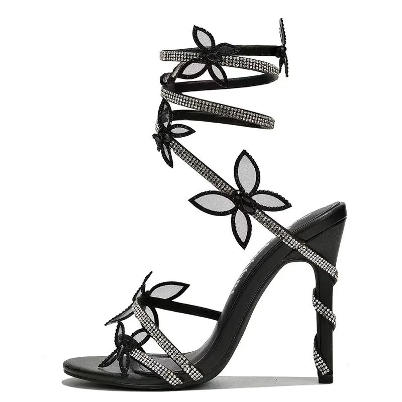 Snake butterfly rhinestone flower stiletto heel Roman sandals in gold with buckle closure and super high heel
