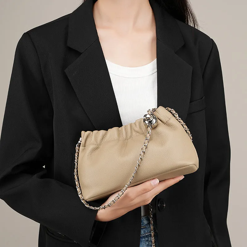 Women's soft genuine leather dumpling-shaped crossbody bag in grey with a chain shoulder strap.