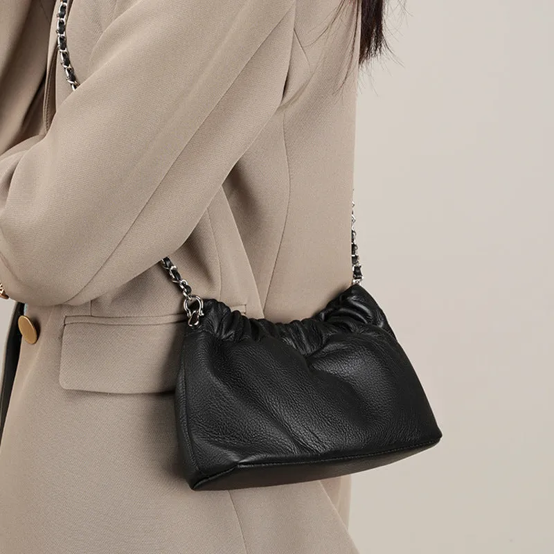 Women's soft genuine leather dumpling-shaped crossbody bag in grey with a chain shoulder strap.