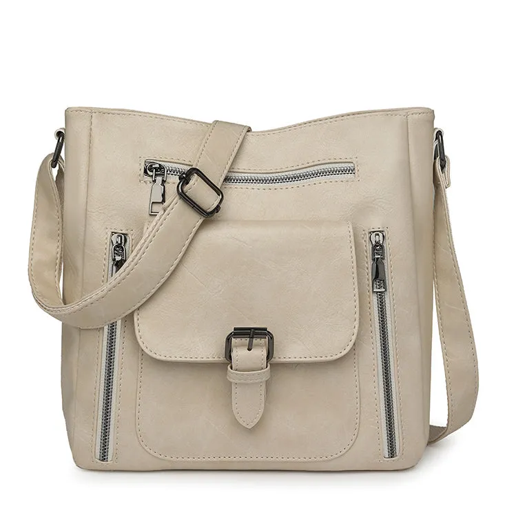 Soft synthetic leather handbag with metal accent in vintage style, colour example shown