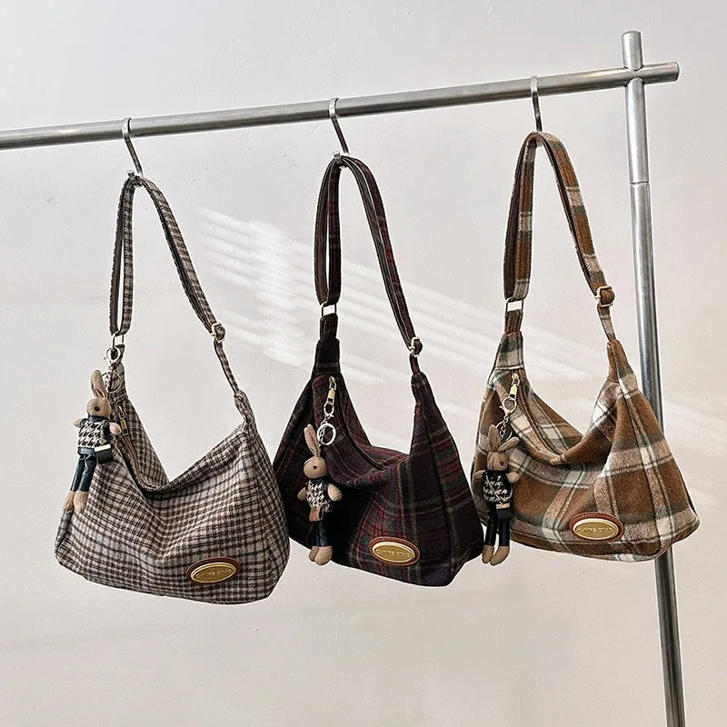 Women's large soft woolen cross-body shoulder bag in a horizontal square shape, shown in a choice of colours.