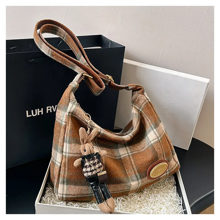 Women's large soft woolen cross-body shoulder bag in a horizontal square shape, shown in a choice of colours.