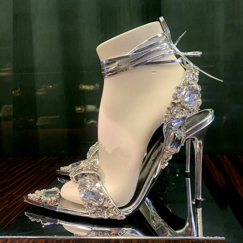 Super high heel pointed toe rhinestone slingback heels in gold on display