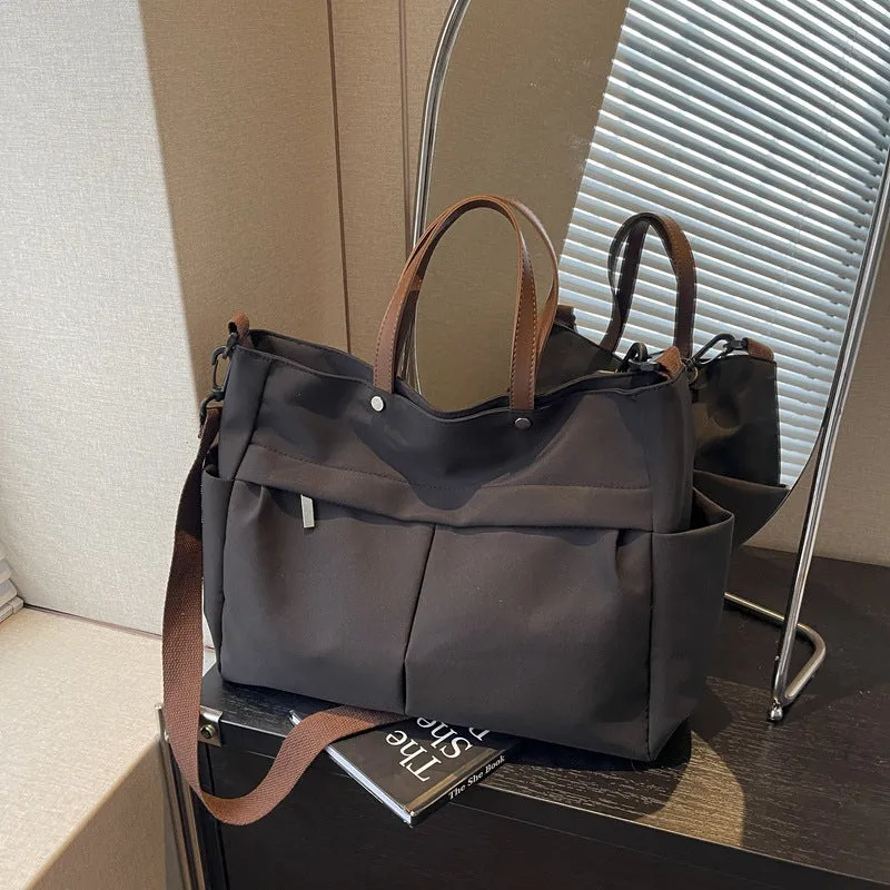 Women's nylon crossbody tote shoulder bag in black colour with measurements 39x14x28cm