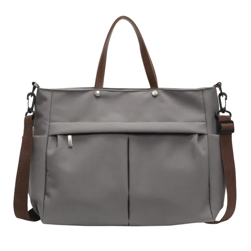Women's nylon crossbody tote shoulder bag in black colour with measurements 39x14x28cm