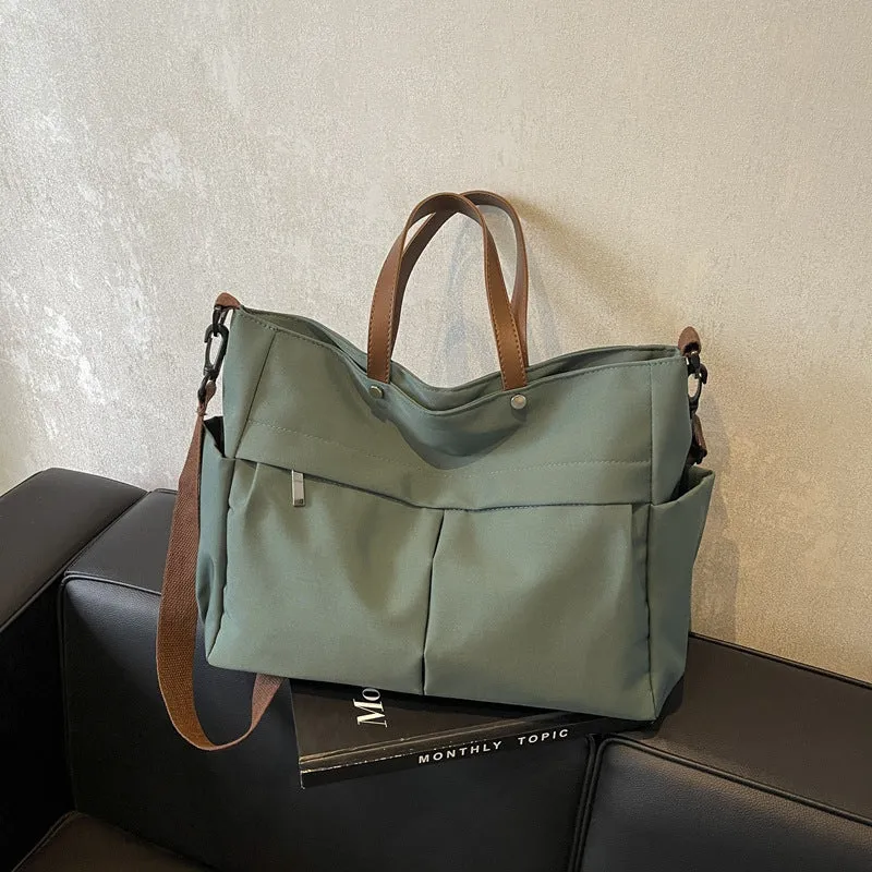 Women's nylon crossbody tote shoulder bag in black colour with measurements 39x14x28cm