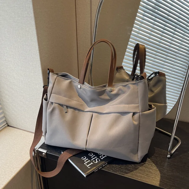 Women's nylon crossbody tote shoulder bag in black colour with measurements 39x14x28cm