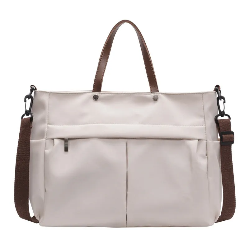 Women's nylon crossbody tote shoulder bag in black colour with measurements 39x14x28cm