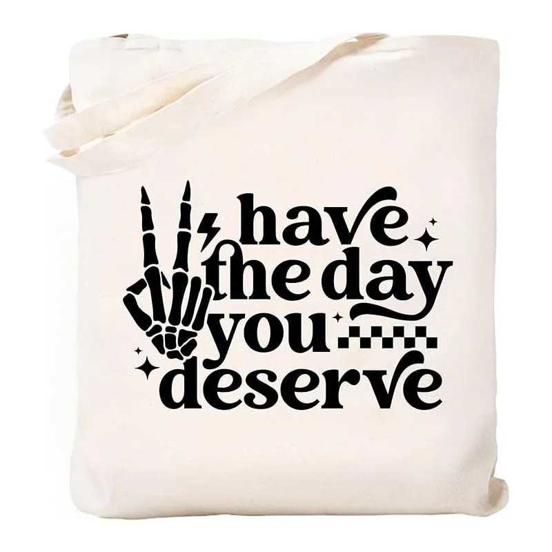 White canvas hand shopping bag with Halloween digital print, 34 by 42 centimetres, on plain background