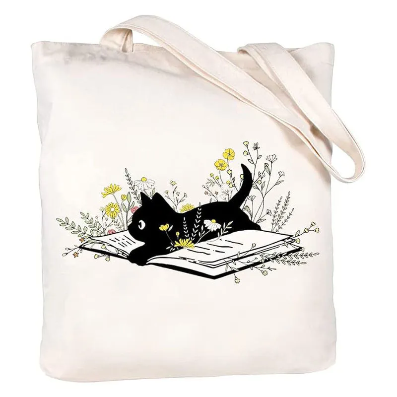 White canvas hand shopping bag with Halloween digital print, 34 by 42 centimetres, on plain background