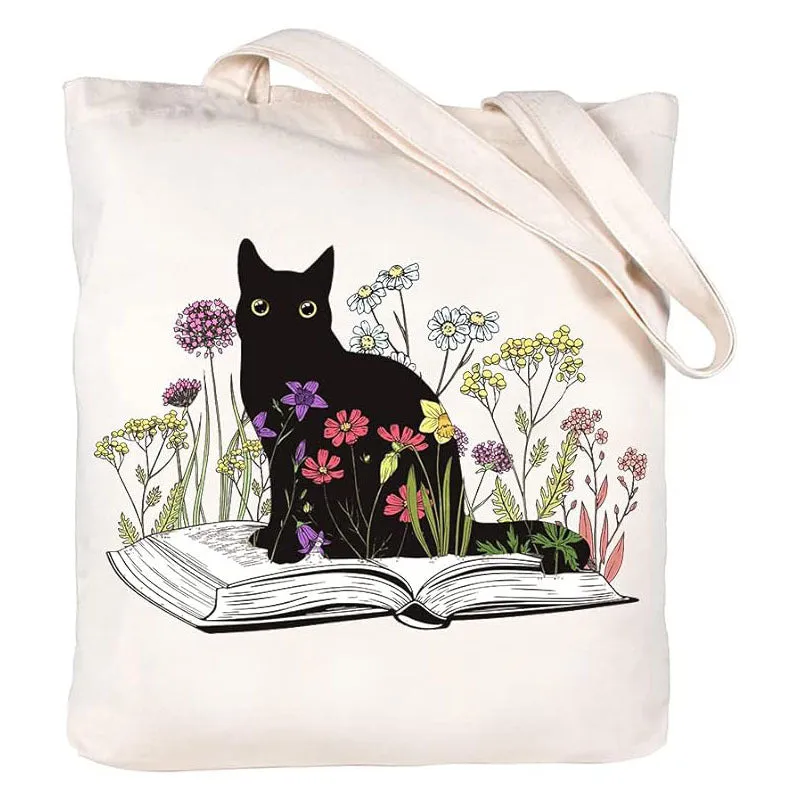 White canvas hand shopping bag with Halloween digital print, 34 by 42 centimetres, on plain background