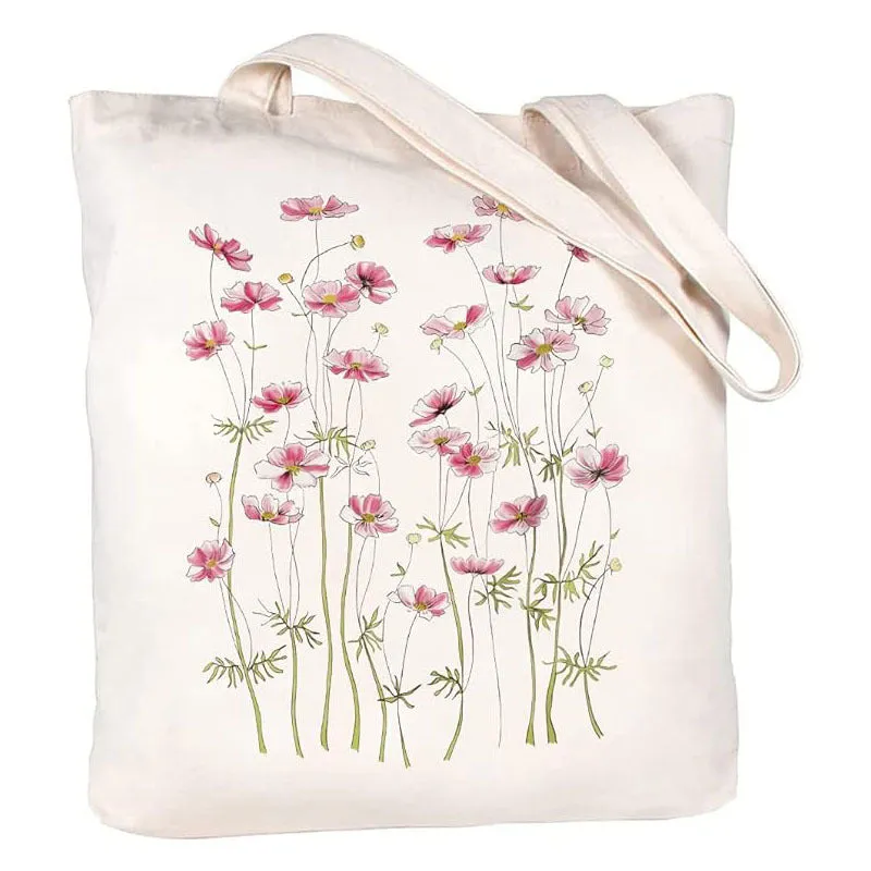 White canvas hand shopping bag with Halloween digital print, 34 by 42 centimetres, on plain background