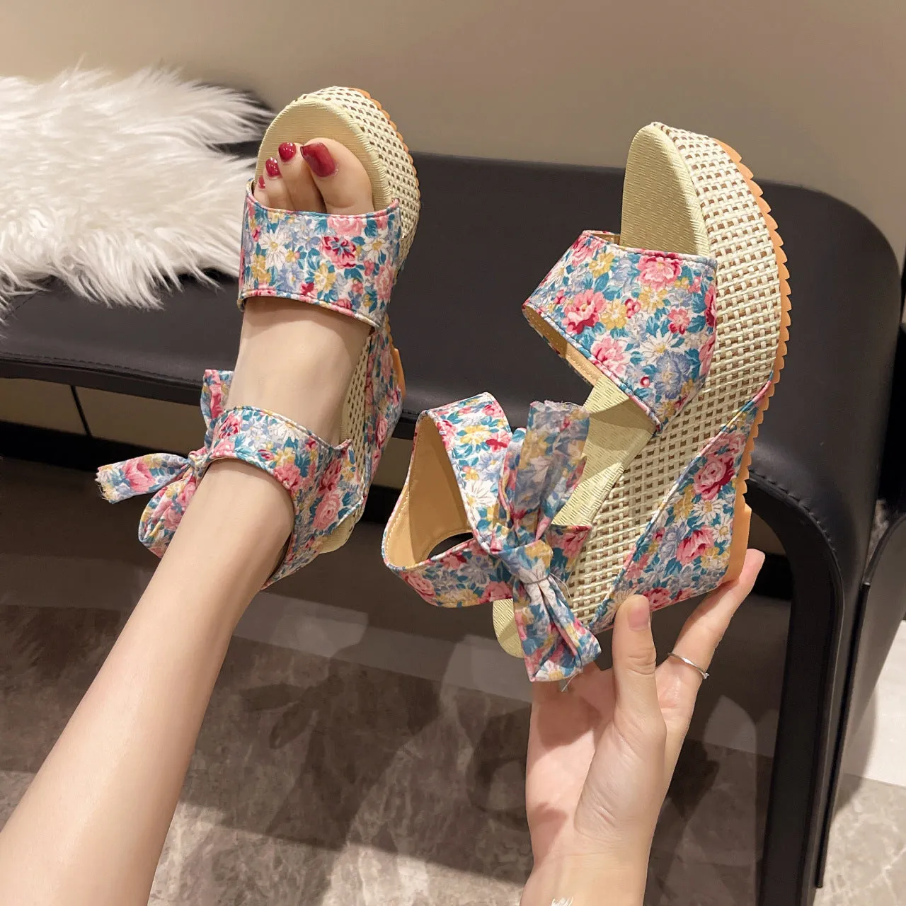 Women's floral wedge sandals with fish mouth peep toe and ankle strap buckle in pink, black, and blue patterns.