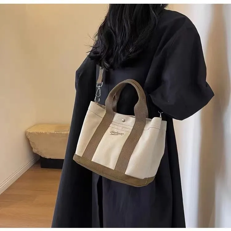 Beige canvas messenger bag with three shoulder straps and sandwich pocket for outdoor and everyday use