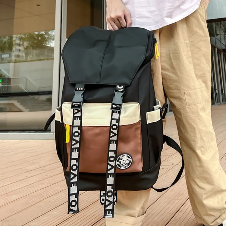 A mid-size black Oxford cloth backpack shown with handheld and two-shoulder carry options.