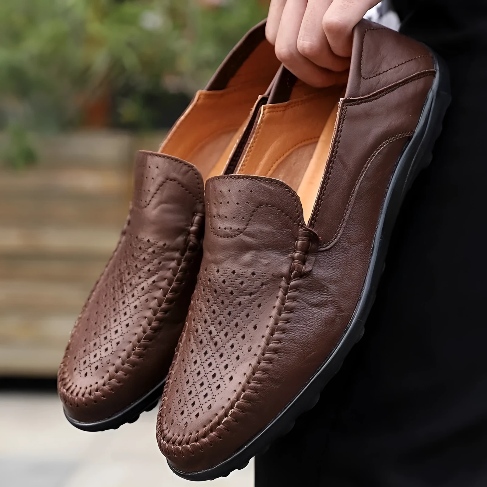 Men's slip-on business shoes with hollowed-out perforated pigskin leather upper in black colour